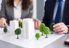 How do real estate businesses contribute to a greener environment?
